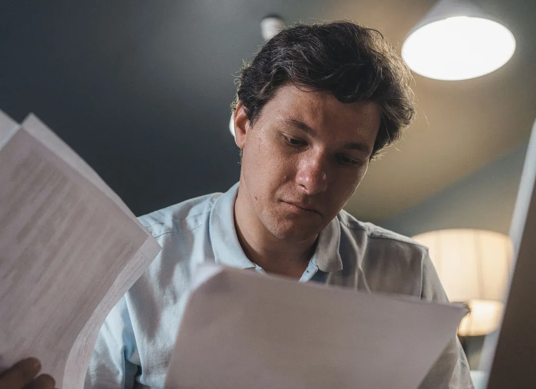 Construction business owners reviewing financial documents
