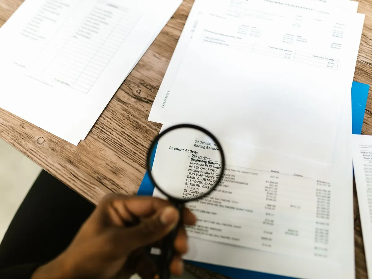 Forensic accountant reviewing financial records and investigation documents