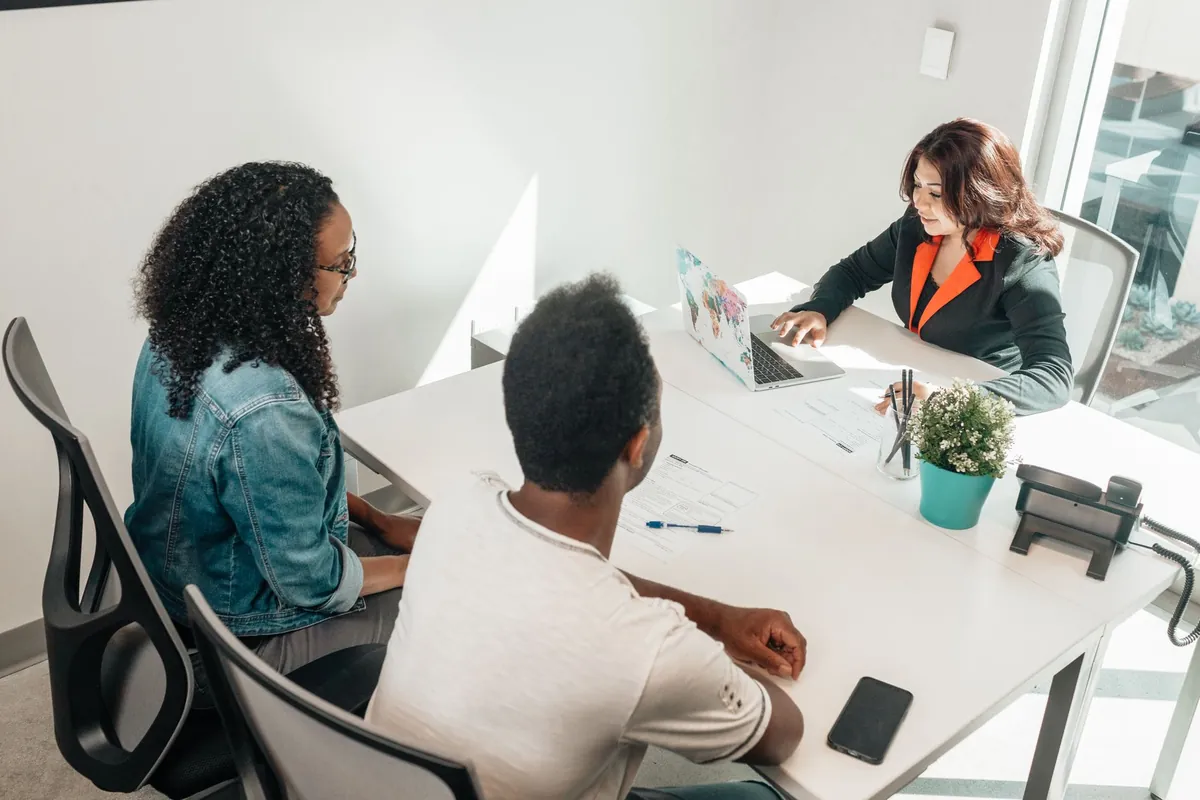 Real estate accounting specialists reviewing property-level financial reports