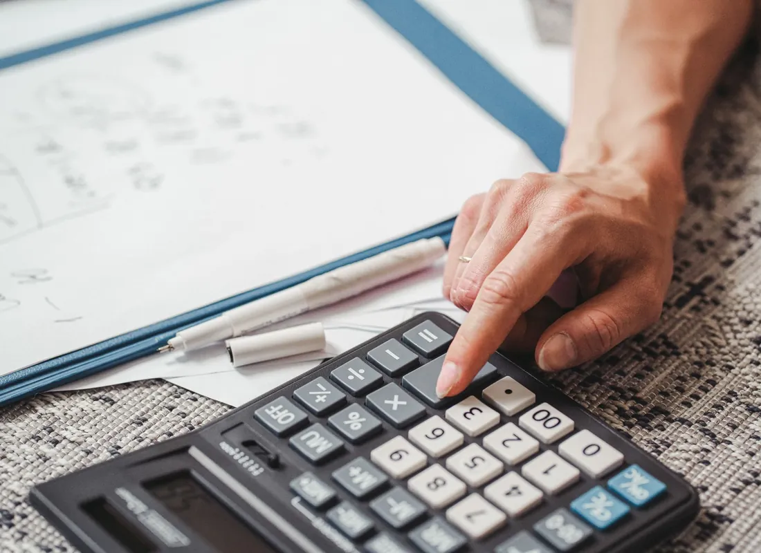 Real estate business owners reviewing financial documents