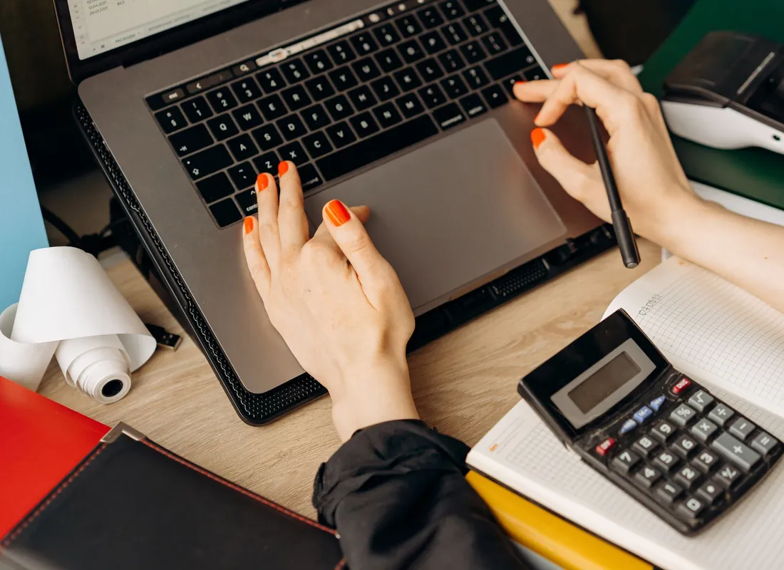 Boston business owners reviewing financial documents together