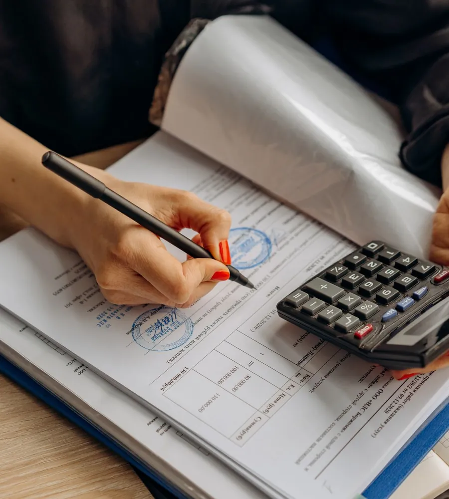 Electrical contractor reviewing project costs and bookkeeping records