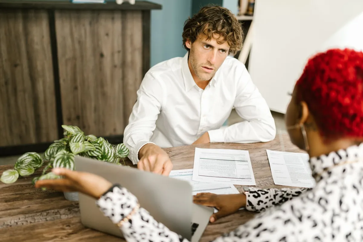 Franchise bookkeeping specialists reviewing multi-location financial reports