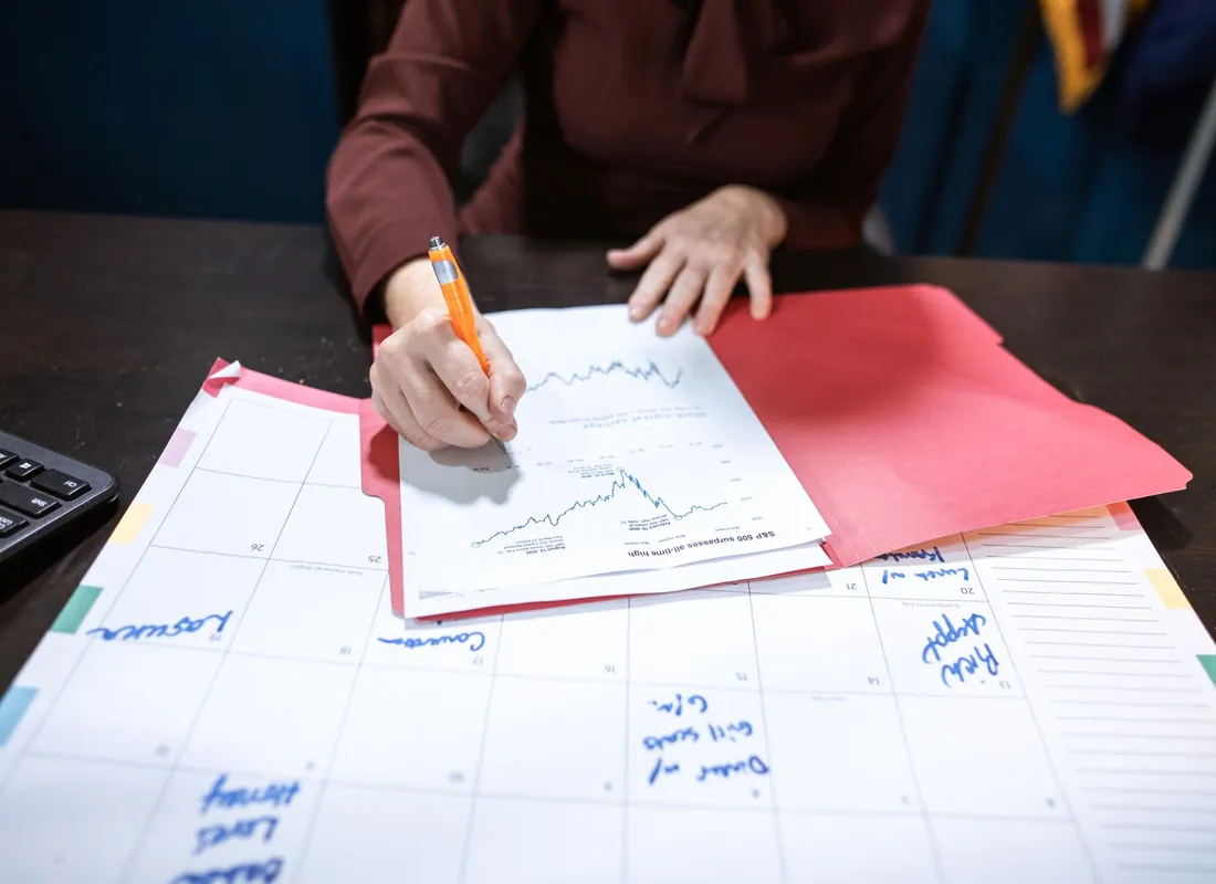 Law firm professionals reviewing financial documents together