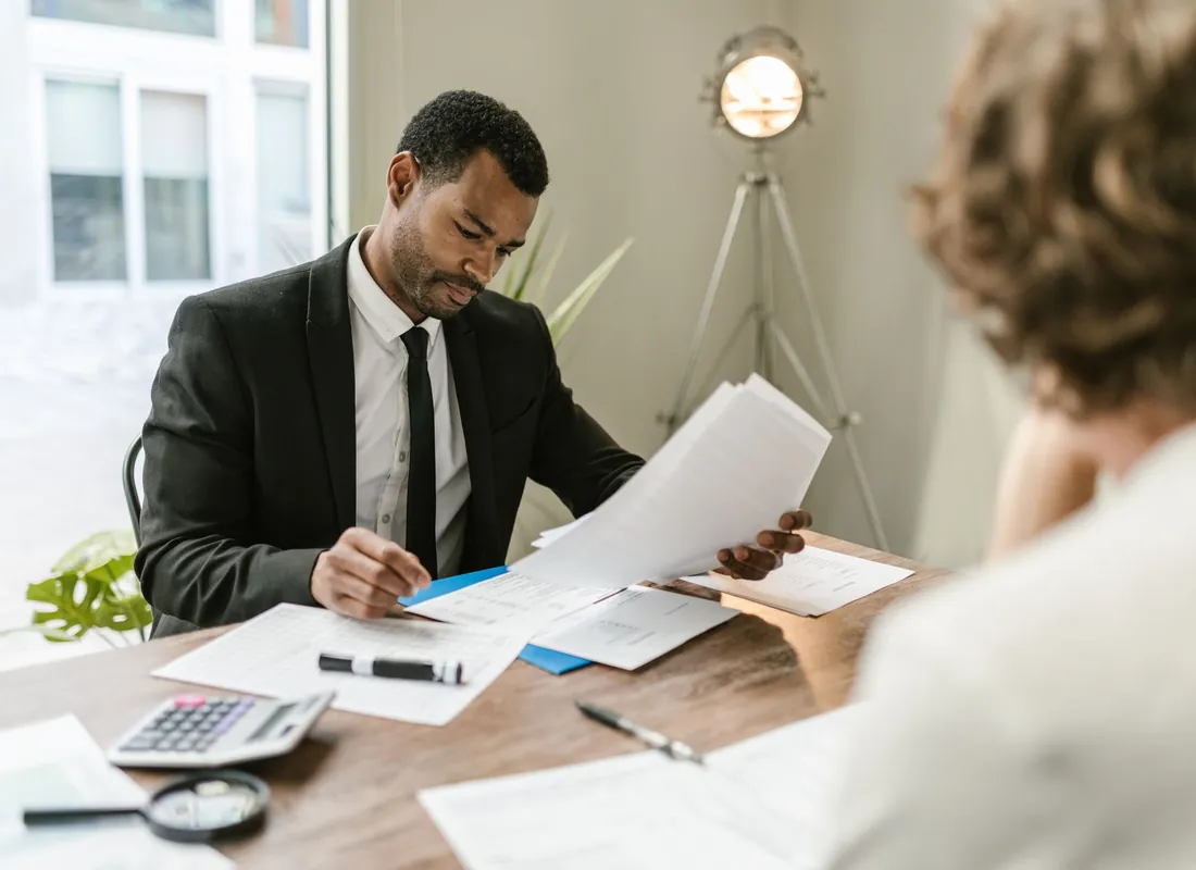 Oil and gas business owners reviewing financial documents
