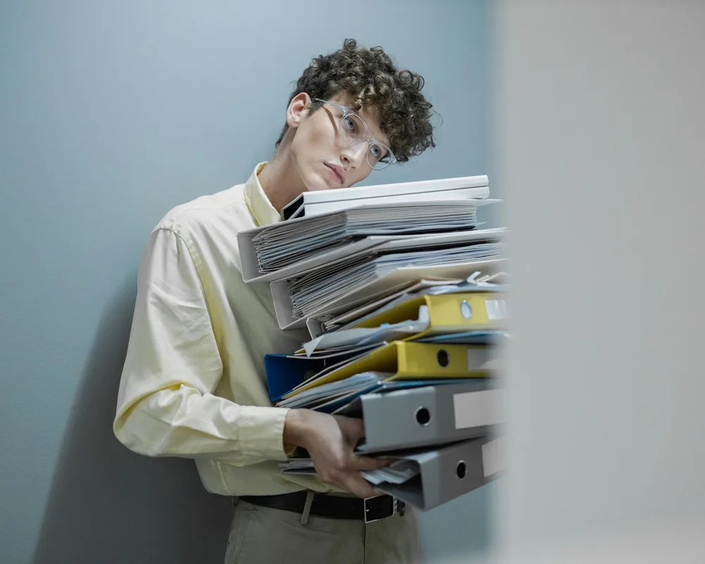 Worker handling payroll paperwork